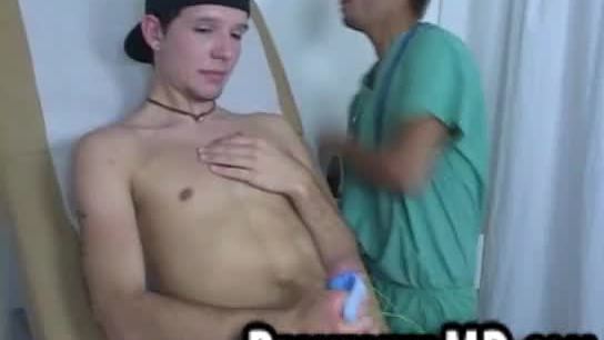 This sexy hunk doctor uses toys on this hunks cock